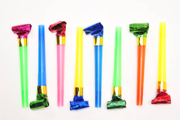 istock Carnival whistles of different colors on a white background 1360521965
