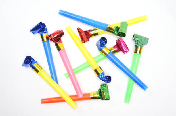 istock Carnival whistles of different colors on a white background 1360521970