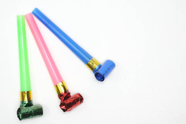 istock Carnival whistles of different colors on a white background 1360521991