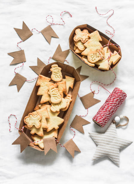 istock Christmas mood. Christmas shortbread cookies and decorations on a light background, top view 1360522555