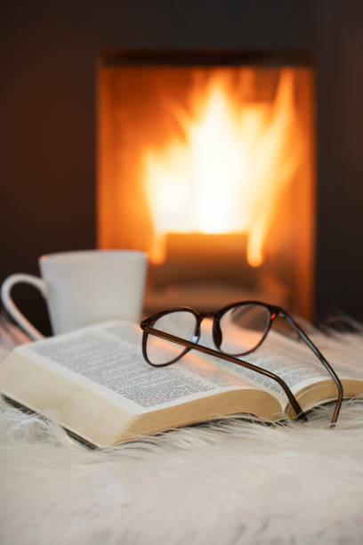 istock Evening at fireplace at home 1360525732