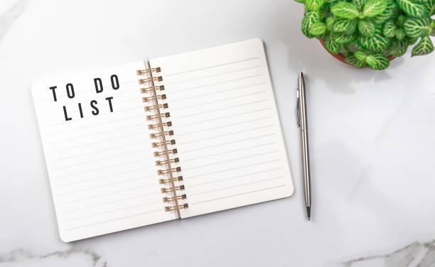 istock To do list for next year. Empty notebook on white table. Office desktop background, top view photo 1360525974
