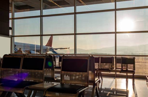 istock Airport waiting room, and plane 1360528812