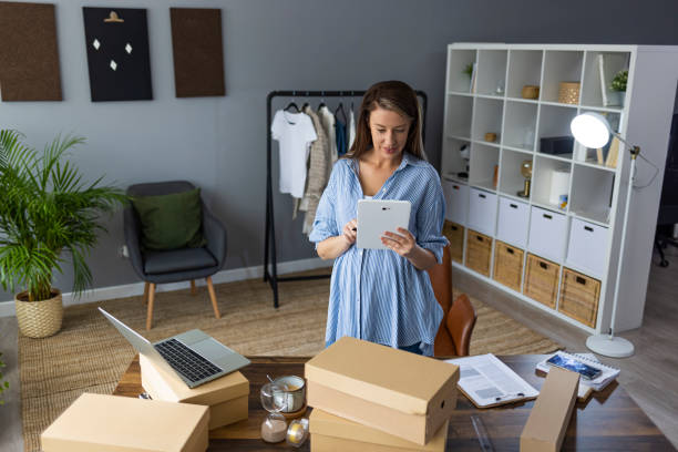 istock Working woman at online shop. 1360530394