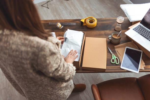 istock Working woman at online shop. 1360530401