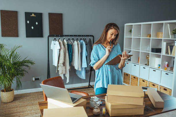 istock Working woman at online shop 1360530419