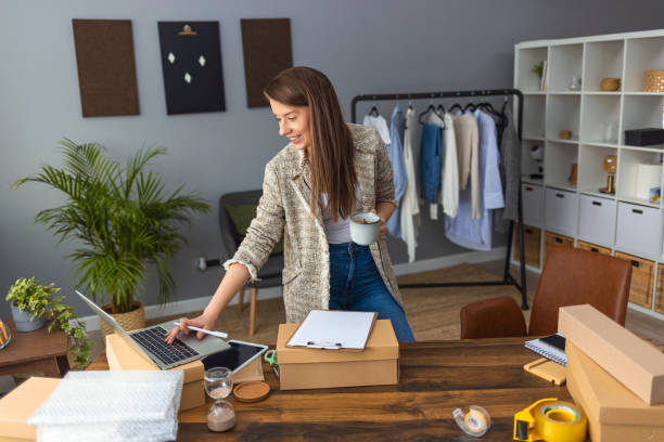 istock Working woman at online shop 1360531091