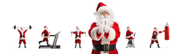 santa claus gesturing thumbs up in front of many santa clauses exercising fitness - healthy lifestyle men boxing dumbbell imagens e fotografias de stock