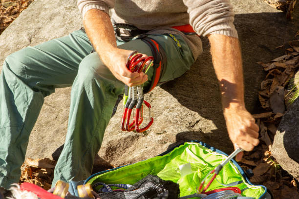 istock Lower section of man preparing to rock climb 1360537301