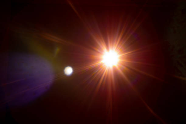 istock Sun flare on the black background 1360537590