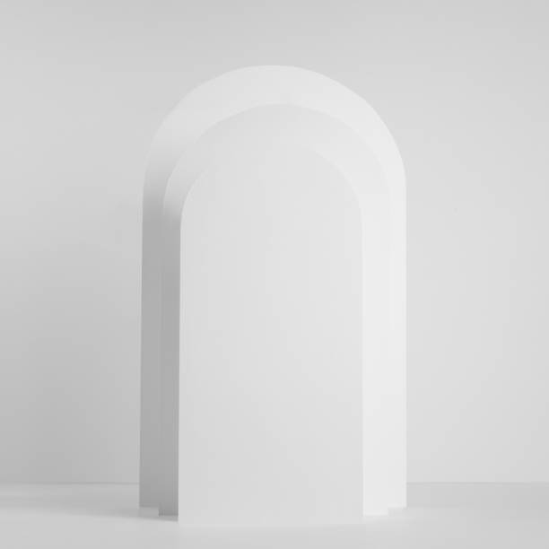 istock White rectangle rounded arches in sunlight with shadows as podium on abstract stage mockup for presentation cosmetic product, design, advertising in simple geometric modern style, square. 1360538834