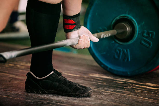 istock close-up athlete and barbell exercise deadlift 1360545093