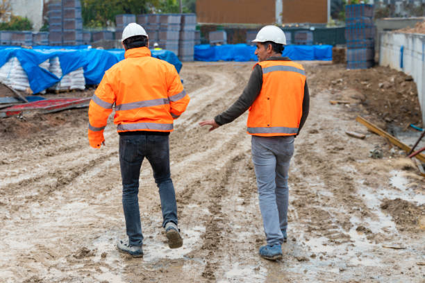 istock Engineer and foreman examining construction site outdoors 1360545205