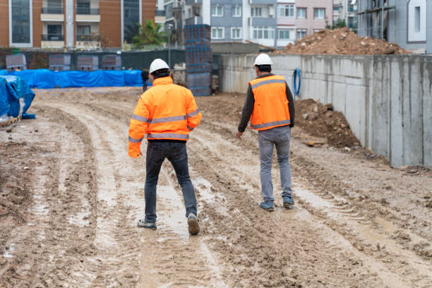 istock Engineer and foreman examining construction site outdoors 1360545260
