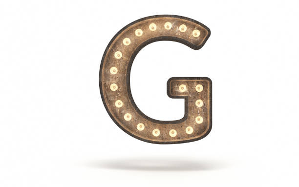 istock Letter G decorated with light bulb covered with concrete 1360546142