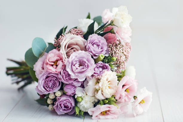 istock beautiful delicate flower bouquet with roses, ranunculuses, eustomas and carnations 1360547224