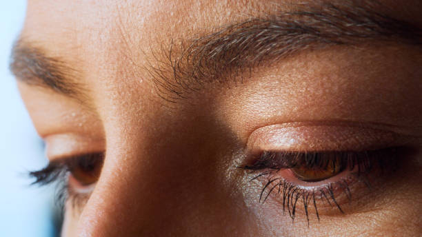 istock Extreme closeup on bright brown eye. Beautiful female face 1360548363