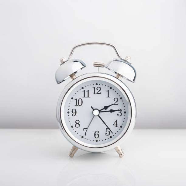 istock Gray glossy metal alarm clock isolated on white background. Isolate 1360548569