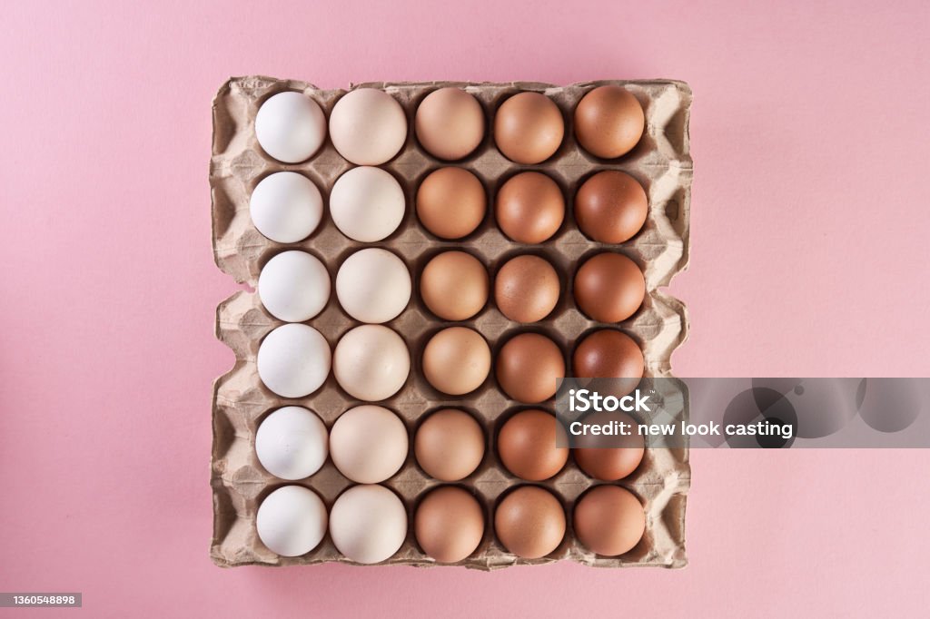 Chicken eggs of natural shades and colors on egg tray Easter Egg Stock Photo