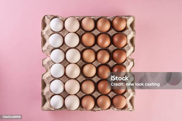 Chicken Eggs Of Natural Shades And Colors On Egg Tray Stock Photo - Download Image Now