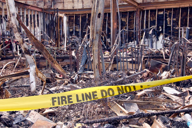istock Building fire with contents inside shown, barricade tape 1360553314