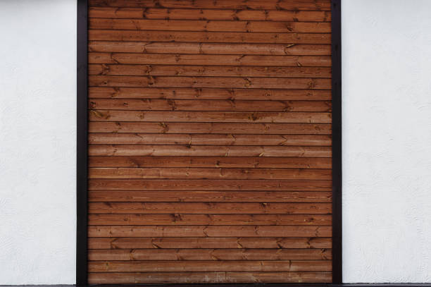 istock The combination on the wall two different textures - brown wood planks and a white decorative plaster 1360553989