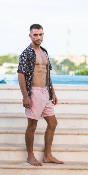 istock fit male model posing without shirt 1360558341