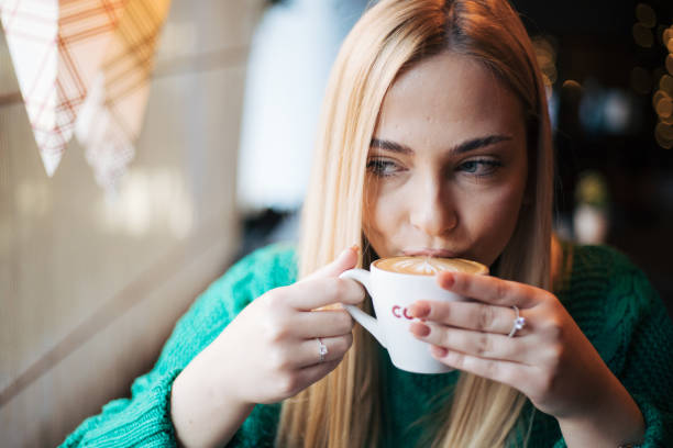 Pretty blonde woman in a cafe.