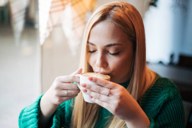 Pretty blonde woman in a cafe.