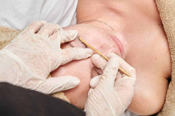 istock professional masseur doing a session of wood therapy to a client 1360562611