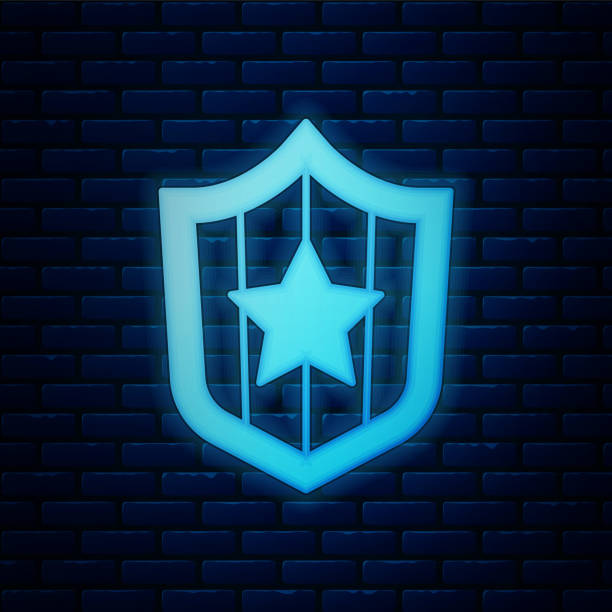 istock Glowing neon Shield with stars and stripes icon isolated on brick wall background. United States of America country flag. 4th of July. USA Independence day. Vector 1360563173