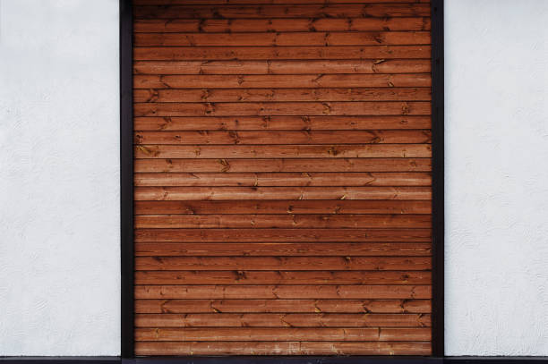istock The combination on the wall two different textures - brown wood planks and a white decorative plaster 1360563780