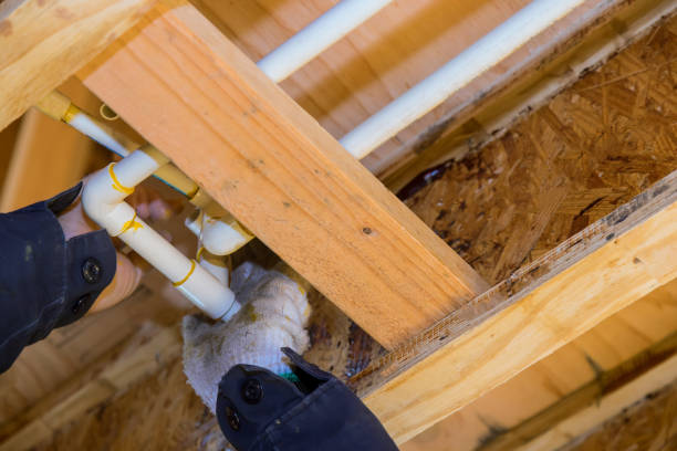 istock The worker is using a glue PVC pipe for installing the water pipe 1360564034