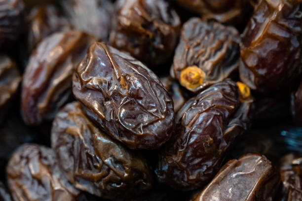 istock Dried date fruits lie in an open box 1360565279