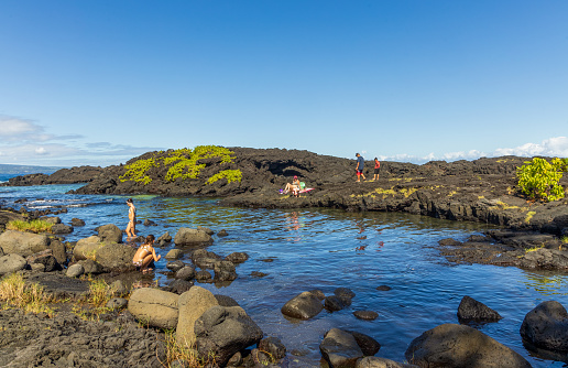 Hilo, Hawaii - November 27, 2021: Richardson Ocean Park on Big Island, Hawaii. People enjoy the beach