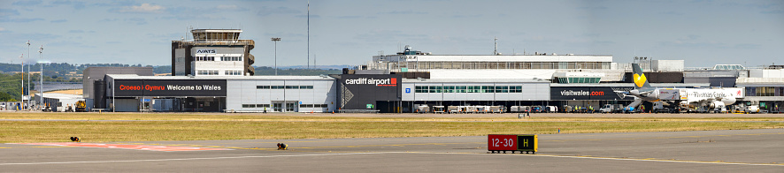 Cardiff, Wales - July 2018: Panoramic view of the airport terminal and control tower at cardiff Wales Airport. Ther airport is owned by the Welsh Government.