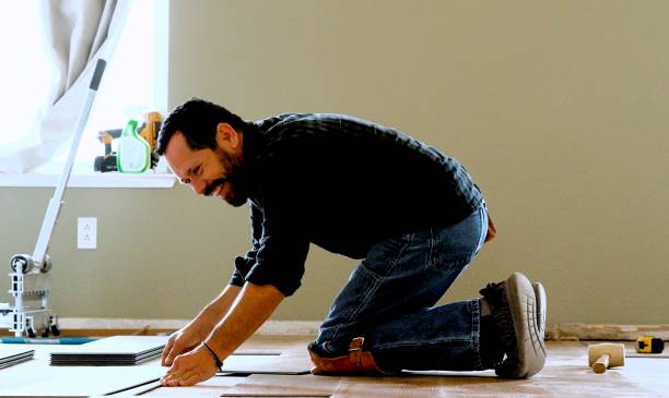 istock Installing wooden vinyl floor 1360579517