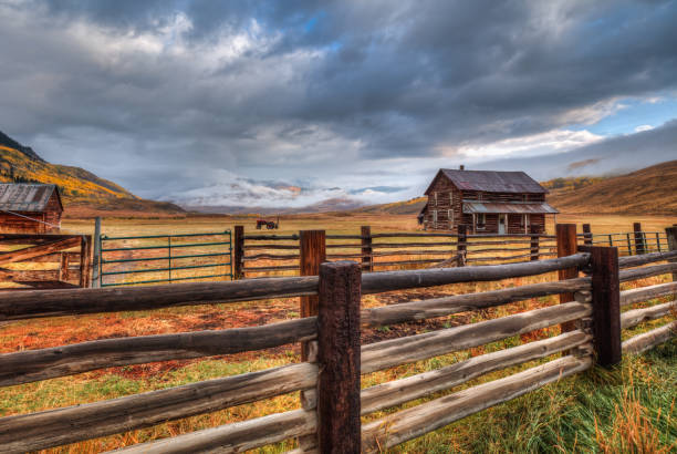 istock AUTUMN STORM OVER AN OLD FARMHOUSE 1360582371
