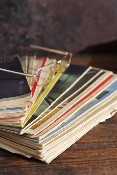istock Old magazines and glasses 1360583133
