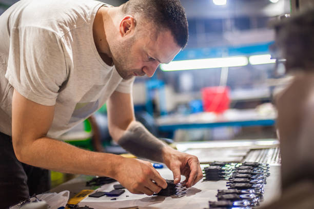 istock Technician making fridge magnet with soft PVC rubber in mold 1360586591