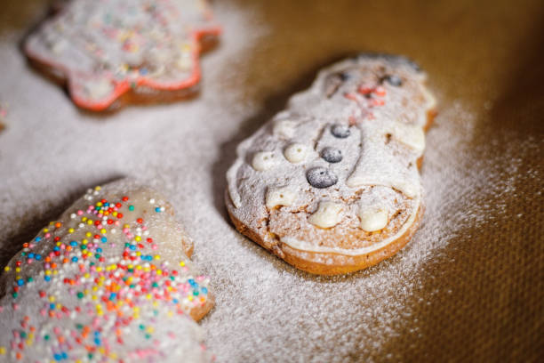 istock Christmas cookies sprinkled with icing sugar on a baking sheet. 1360589063