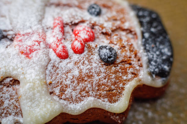 Snowman shaped cookies with powdered sugar close-up