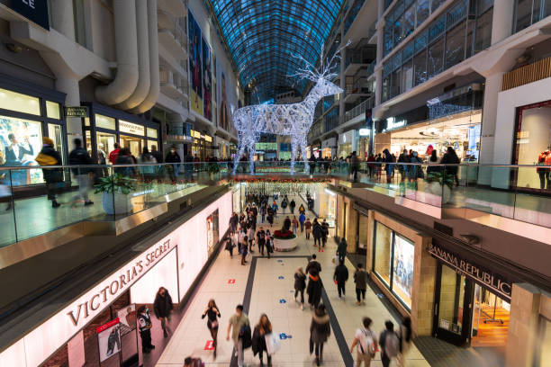 Toronto, Ontario, Canada - December 18 2021 : CF Toronto Eaton Centre during christmas decoration. Crowd people shopping here during covid-19 pandemic period.