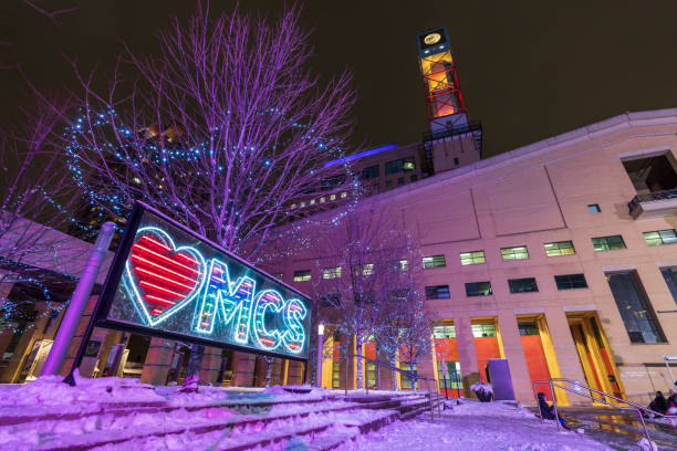 Mississauga City Hall winter night illumination. Celebration Square Ice Skating Rink. stock photo