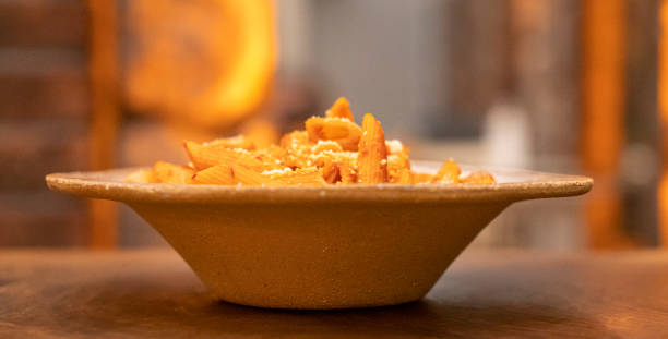 istock Penne pasta in tomato sauce with meat, tomatoes 1360592627