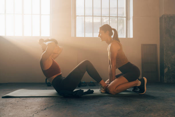 istock Friends Exercising Together at Gym 1360598925