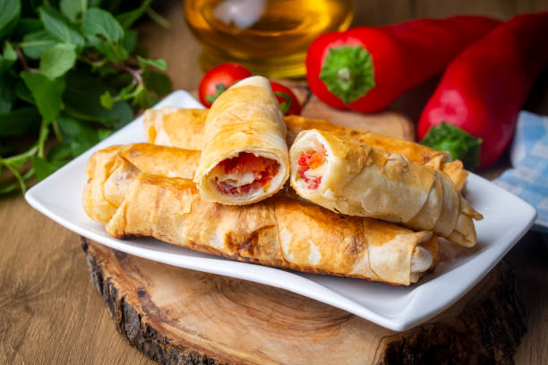 istock Turkish Pacanga Boregi with pastirma (pastrami) and cheddar (melted) cheese. - Pastirmali Borek 1360601984