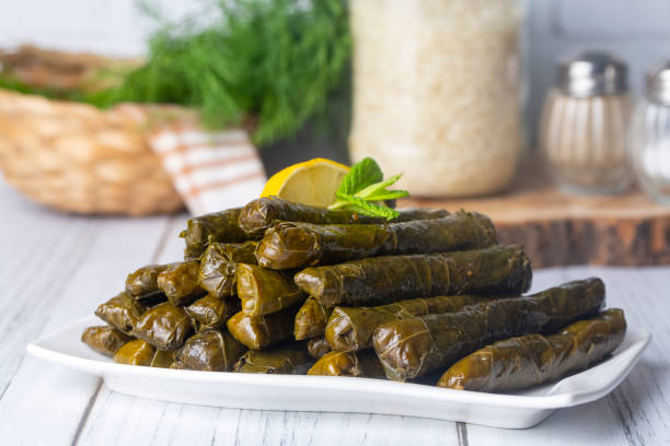 traditional delicious turkish foods; stuffed leaves (yaprak sarmasi) - dolmades imagens e fotografias de stock