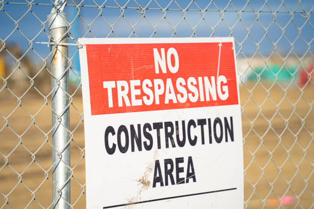 istock No Trespassing sign on Wire Fence at a construction site 1360611583