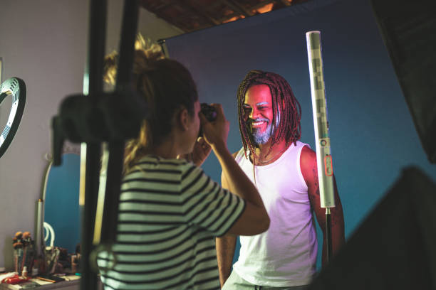 istock Photographer taking photo in studio 1360617509